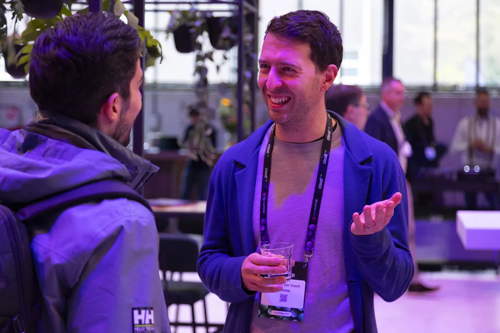 Attendees in conversation during a networking break